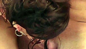 She lovingly sucks and strokes his massive cock until he explodes on her pretty face