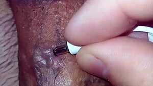 close view of my huge cock's multiple piercing holes