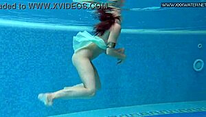 Hottest underwater babe Lizi Vogue swims in tight dress pool