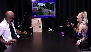 In jail, the bandit's wife Julia Fontanelli straps into special seat on sheer red for public watch.