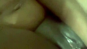 Watch this wet ebony babe fuck her pussy deep with huge dildo