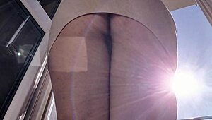 latina babe flashes shaved pussy and ass on balcony without panties