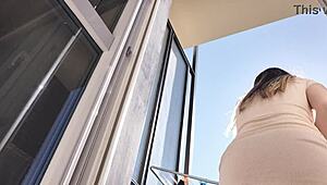 latina babe flashes shaved pussy and ass on balcony without panties