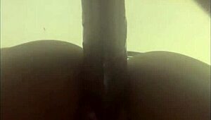 Watch this wet ebony babe fuck her pussy deep with huge dildo