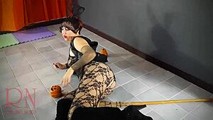 Halloween witch regina noir slips out of black playboy bunny suit backstage