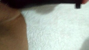 Wife grabs her favorite dildo for some playful homemade fun on camera