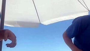 young african crossdresser flashes swollen pussy and monster cock on crowded beach