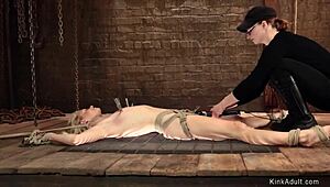 Bound blonde slave chokes on deepthroat in painful lezdom bondage agony